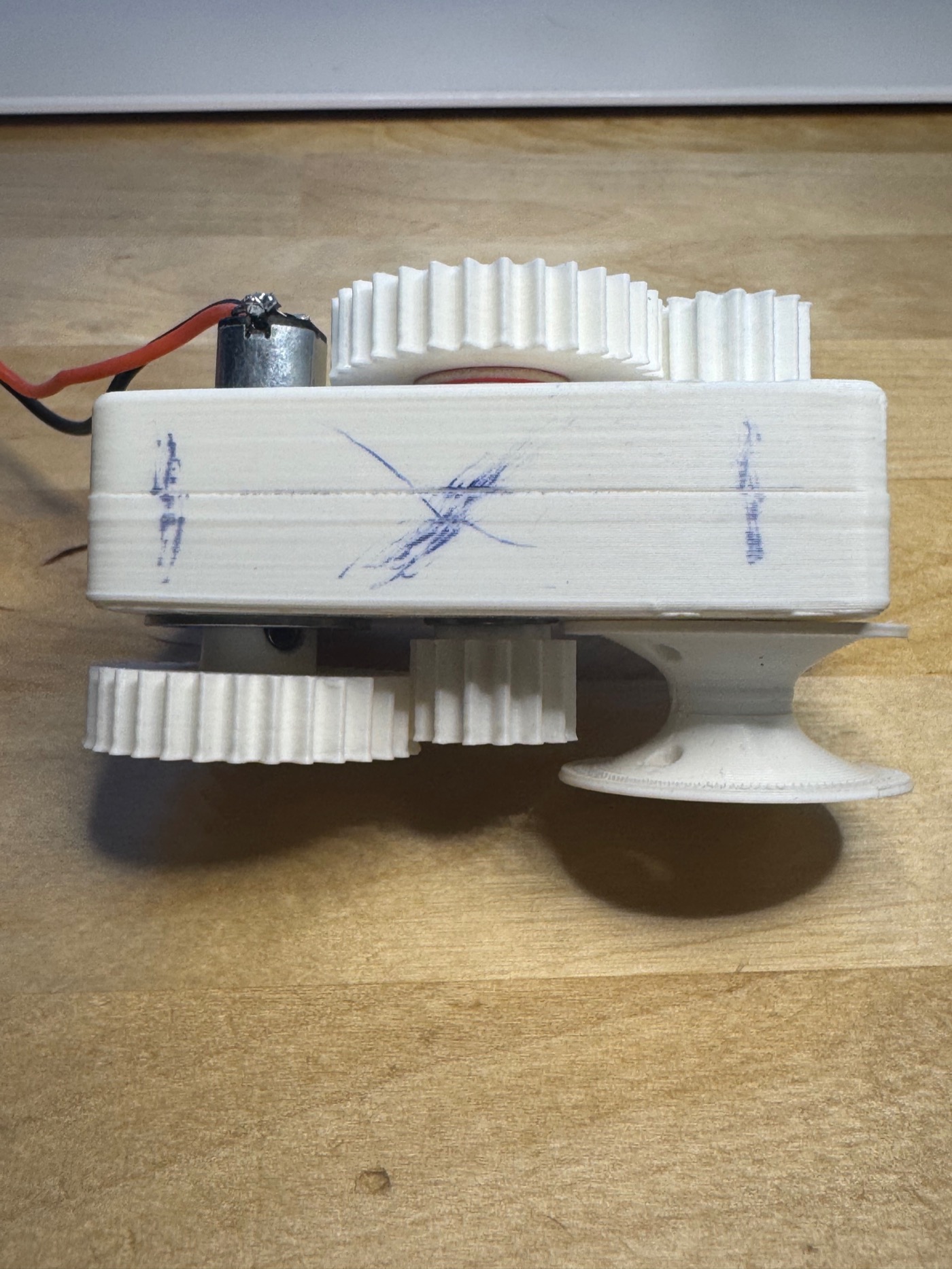 The runner-up worm gearbox, cased, with an X inked on the housing