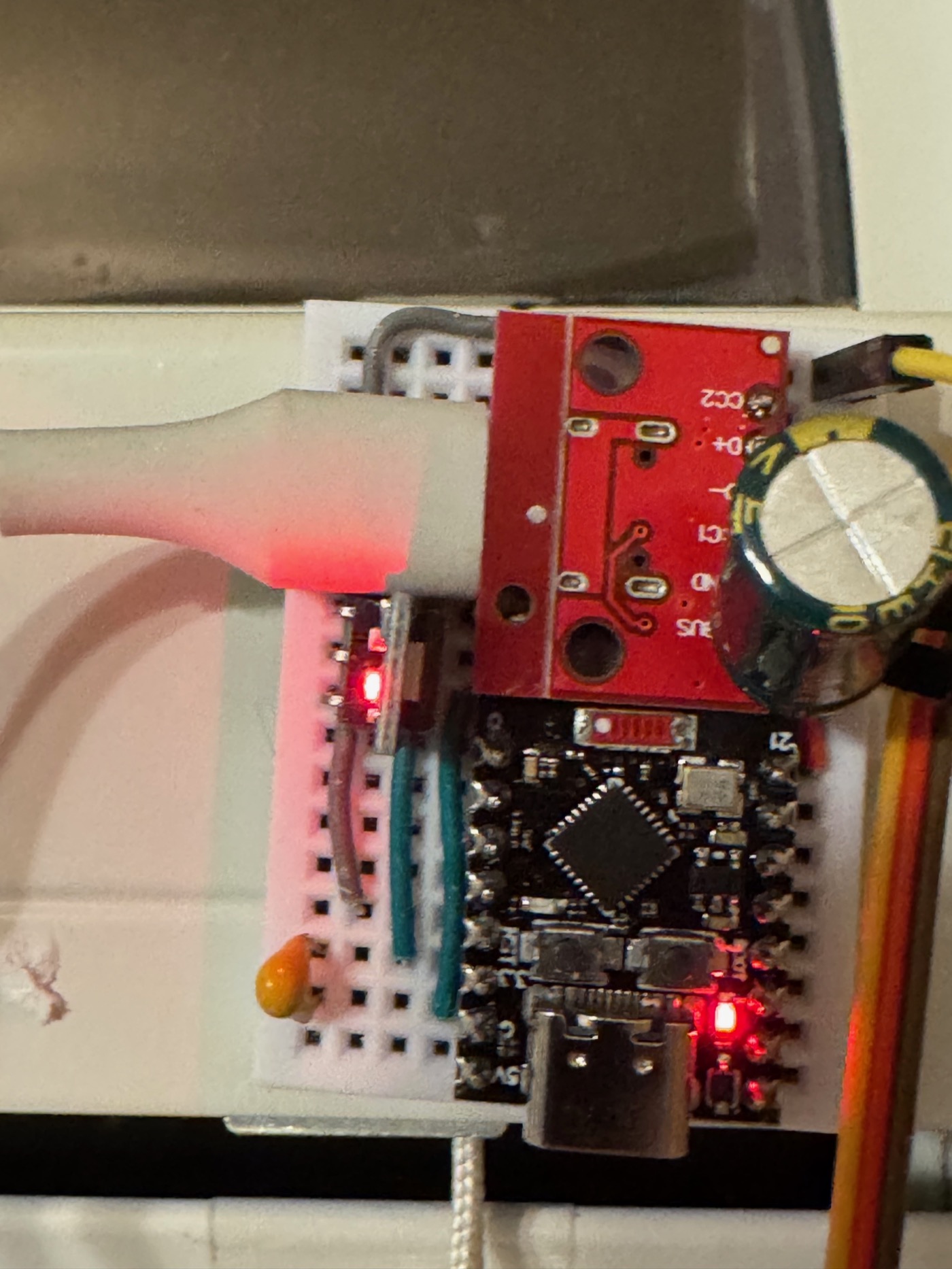 Early breadboard with the motor driver lit up