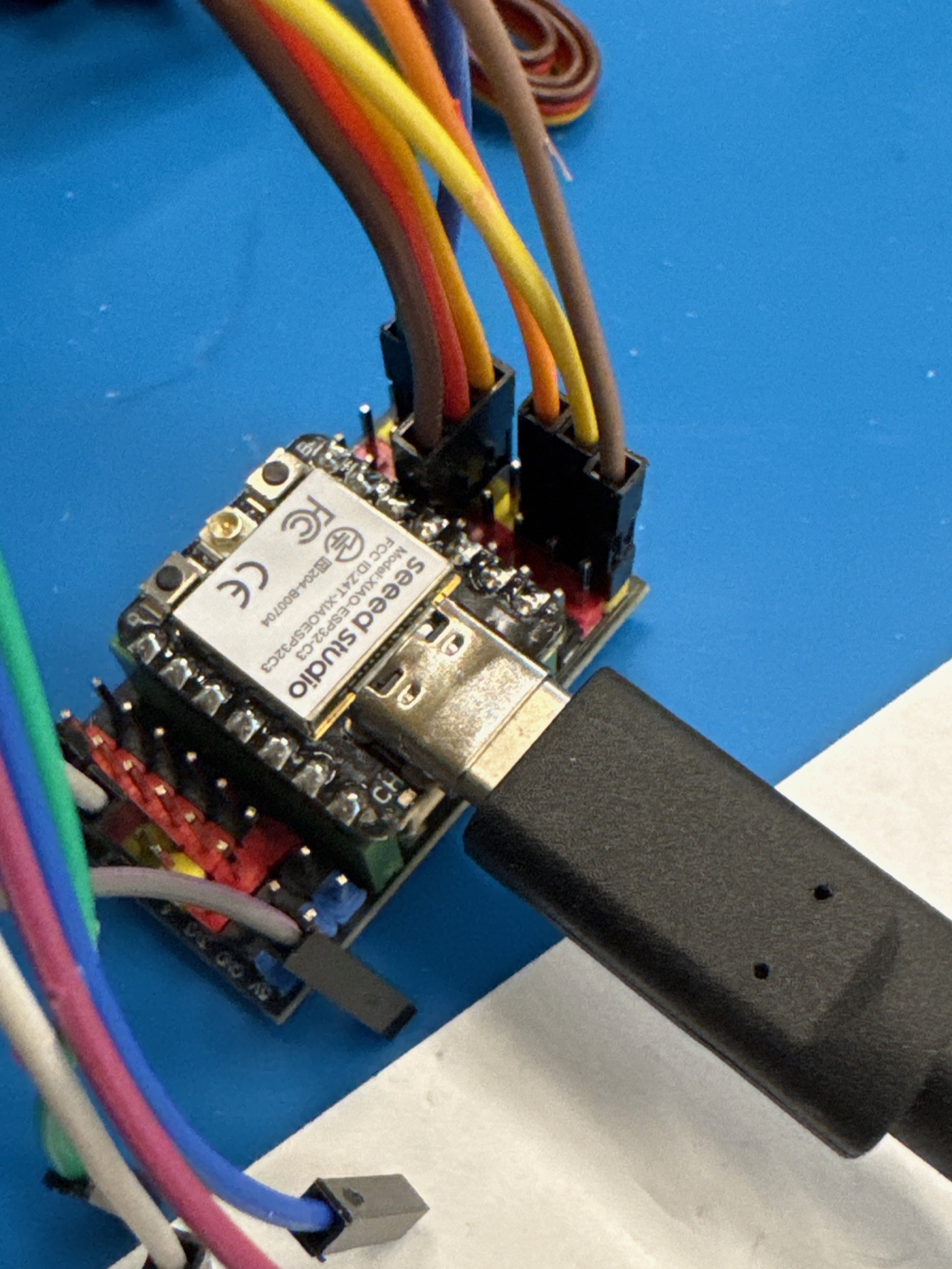 XIAO ESP32-C3 wired with jumpers on the bench